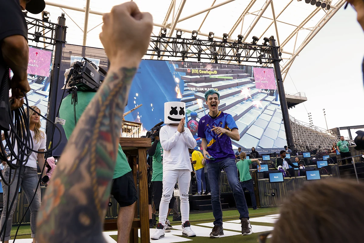 <div class="paragraphs"><p>Tyler Blevins, with DJ Christopher Comstock, known as Marshmello, after winning the Fortnite: Battle Royale Celebrity Pro Am in 2018. (Photographer: Patrick T. Fallon/Bloomberg)</p></div>