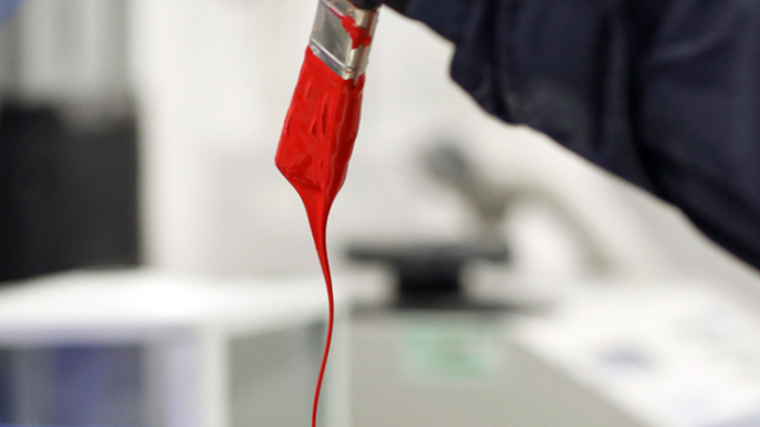 <div class="paragraphs"><p>An employee dips a paint brush in a pot. (Photographer Chris Ratcliffe/Bloomberg)</p></div>