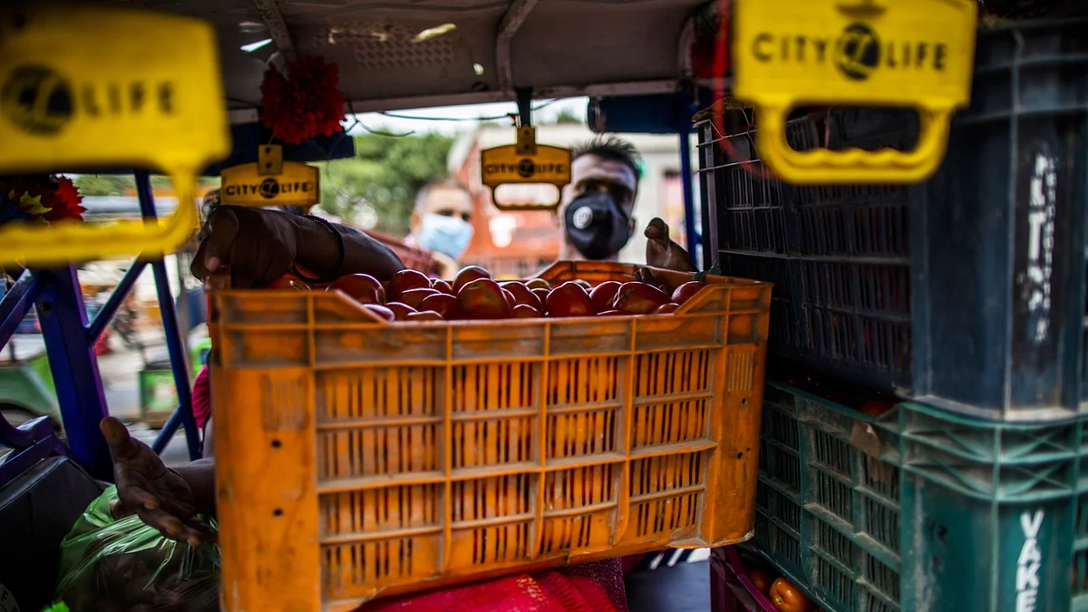 <div class="paragraphs"><p>A vendor transports a crate of tomatoes at the Ghazipur Wholesale Fruit and Vegetable Market in New Delhi. ( Photographer: Prashanth Vishwanathan/Bloomberg)</p></div>