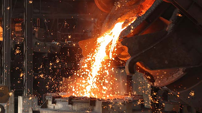 <div class="paragraphs"><p>Pig iron is poured into a molding machine at Tata Metaliks Ltd. (Source: Company website)</p></div>
