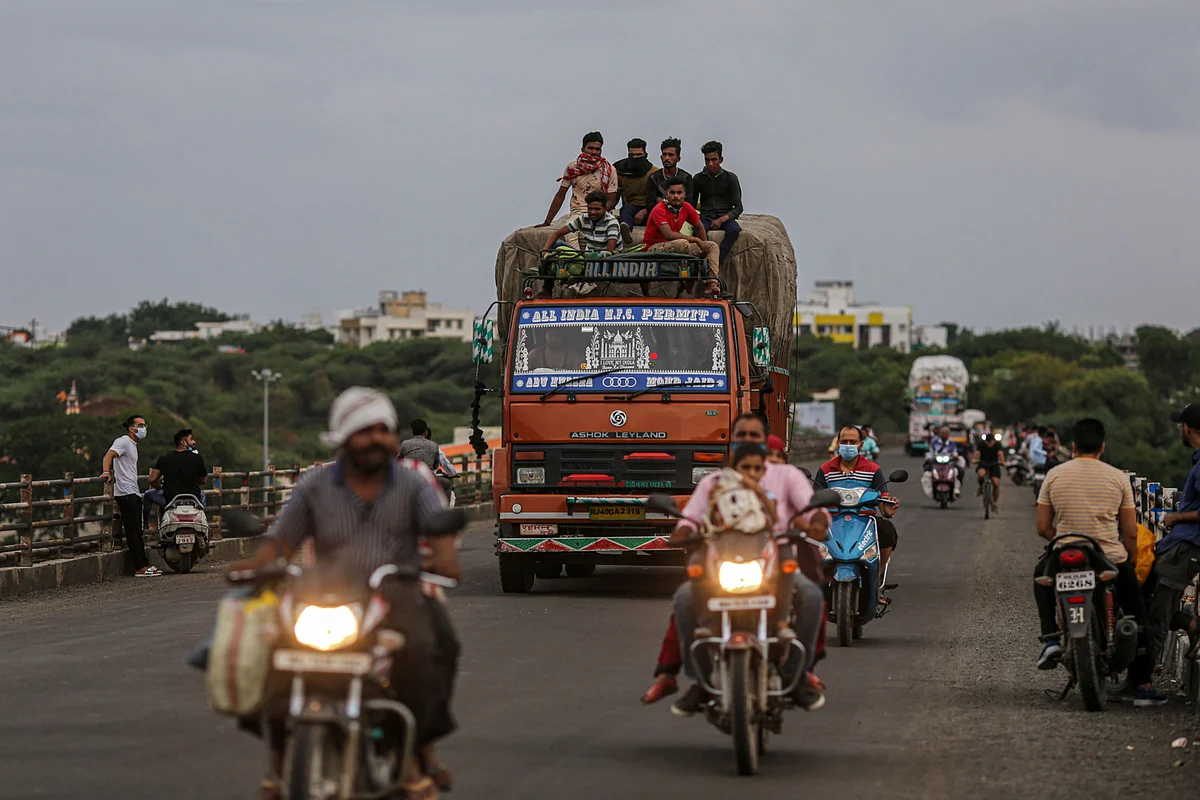 <div class="paragraphs"><p>Passengers travel atop a truck in Jalgaon, Maharashtra, India, on Monday, July 19, 2021. Photographer: Dhiraj Singh/Bloomberg</p></div>