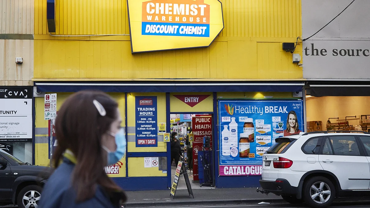 <div class="paragraphs"><p>A pedestrian wearing a protective mask walks past a Chemist Warehouse Group pharmacy in the Brunswick suburb of Melbourne, Australia. (Photographer: James Bugg/Bloomberg)</p></div>