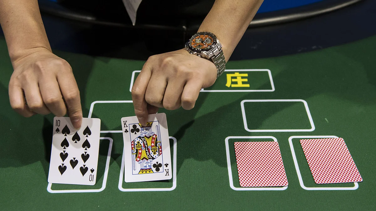 <div class="paragraphs"><p>A dealer handles playing cards on a table at a casino. (Photographer: Xaume Olleros/Bloomberg)</p></div>