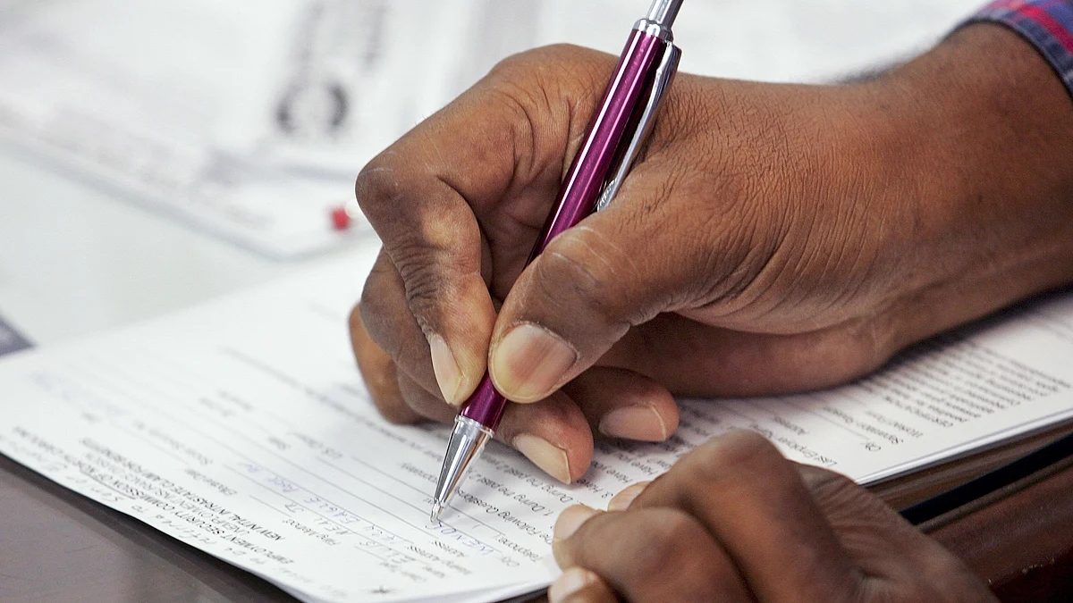 <div class="paragraphs"><p>A job seeker fills out an application form at the Job Links Career Center, part of the North Carolina Employment Security Commission, in Raleigh, North Carolina, U.S. (Photographer: Jim R. Bounds/Bloomberg)</p></div>