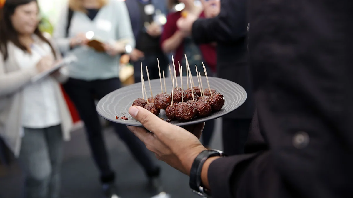 <div class="paragraphs"><p>A worker serves plant-based meatballs. (Photographer: Stefan Wermuth/Bloomberg)</p></div>