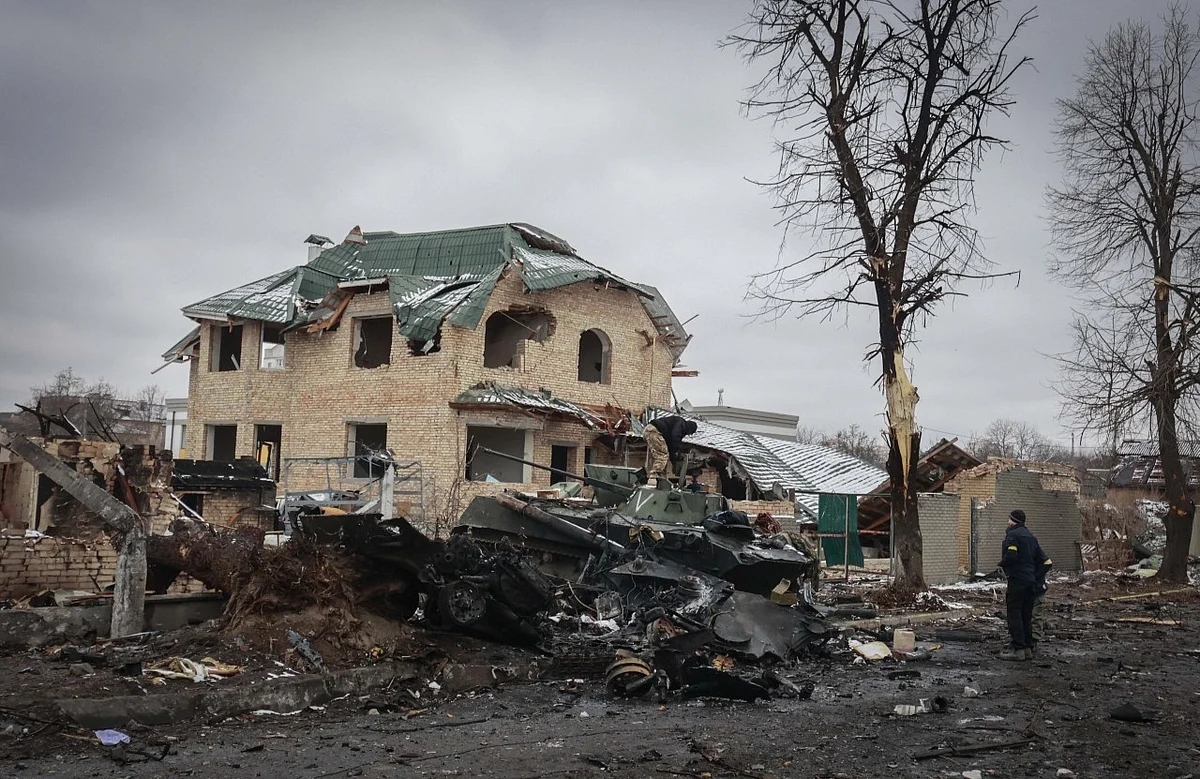 <div class="paragraphs"><p>A man looks at the gutted remains of Russian military vehicles on a road in the town of Bucha, close to the capital Kyiv, Ukraine. (Photo: PTI)</p></div>