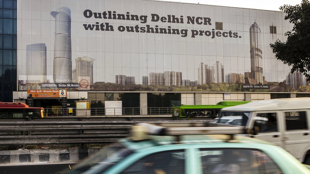 <div class="paragraphs"><p>Traffic passes a billboard picturing the North Eye, right, developed by Supertech Ltd. in New Delhi. (Photographer: Prashanth Vishwanathan/Bloomberg)</p></div>