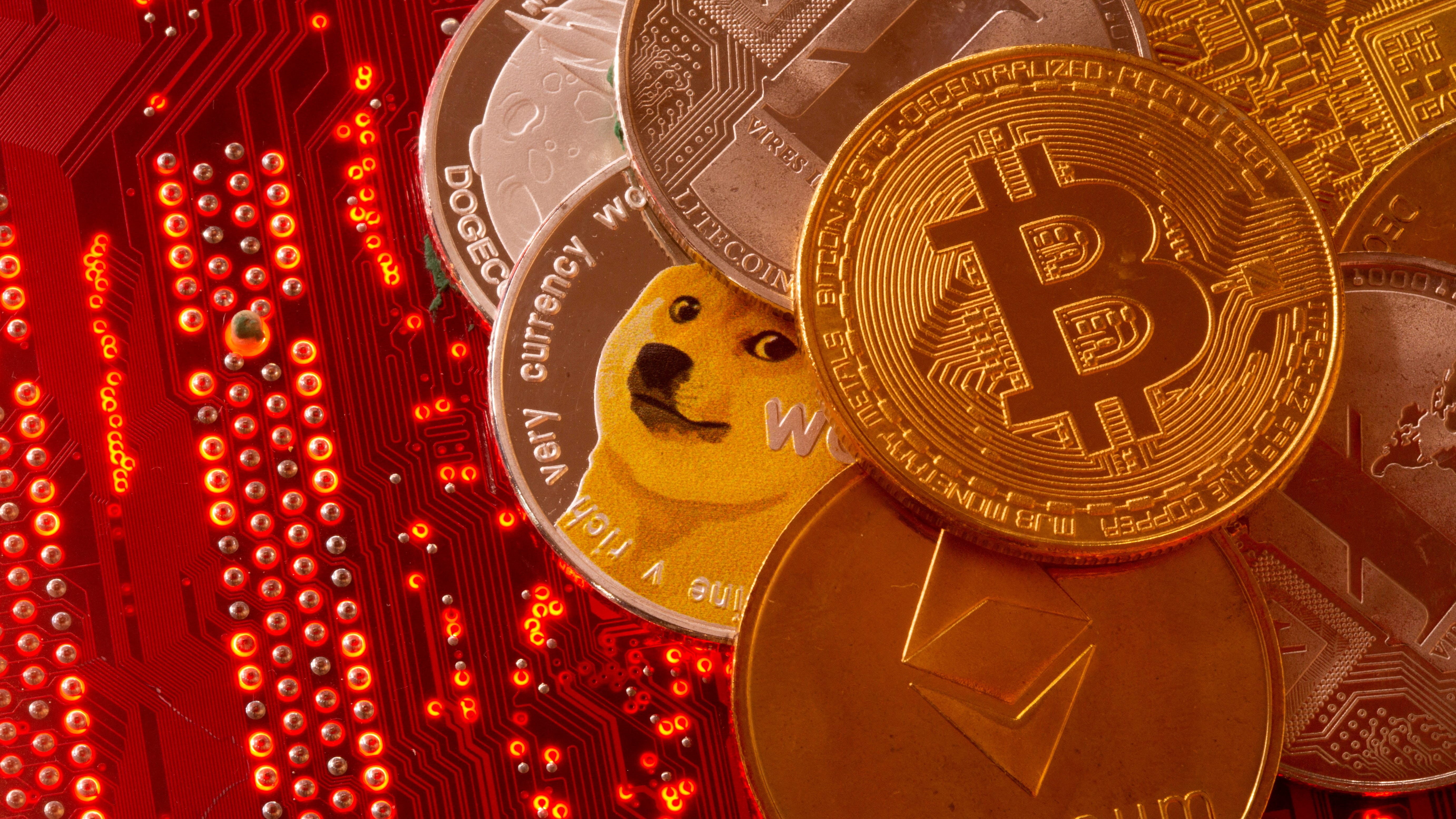 <div of cryptocurrencies Bitcoin, Ethereum, DogeCoin, Ripple, and Litecoin.&nbsp;(Photo: Dado Ruvic/Reuters)</p></p><p></div>