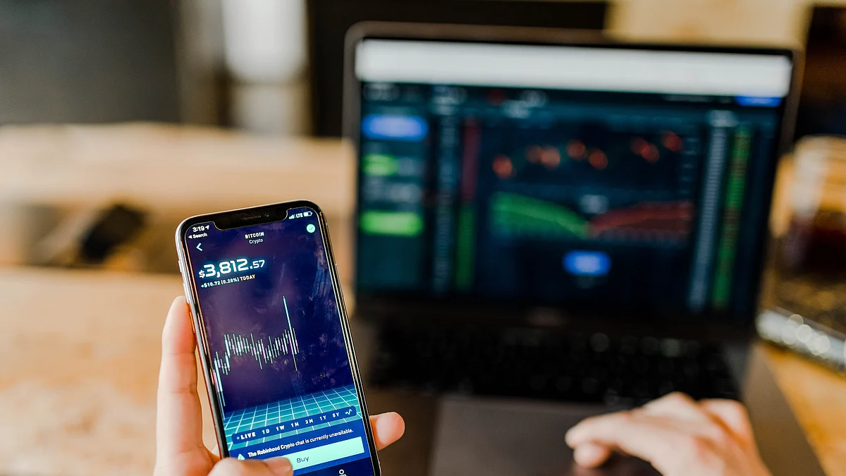 <div class="paragraphs"><p>A man checking the stock chart on his smart phone and laptop. (Photo: Austin Distel/Source: Unsplash</p></div>