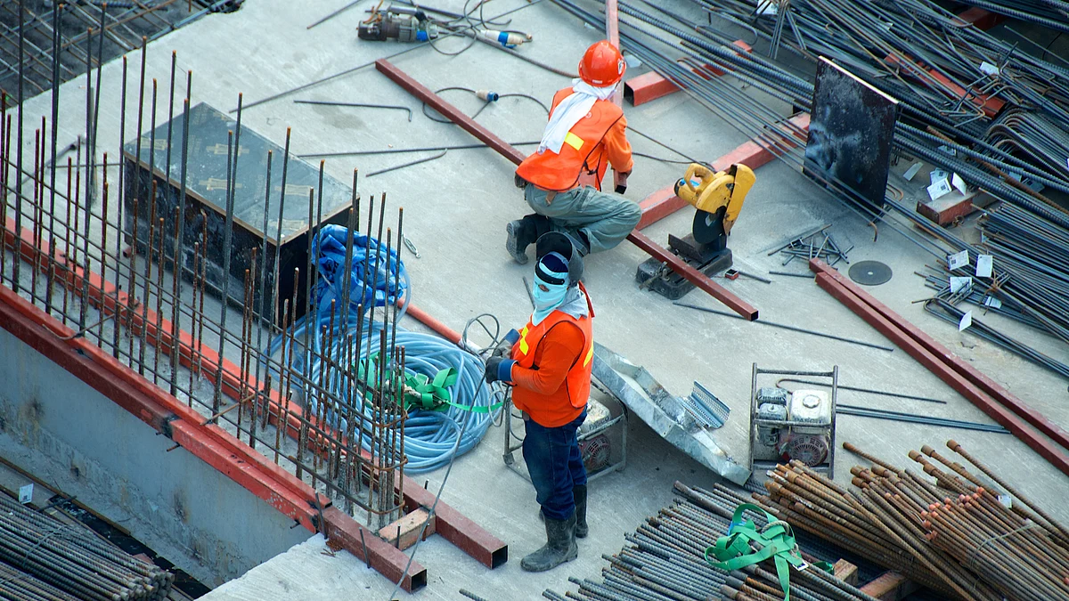<div class="paragraphs"><p>Construction workers on a site. (Photo: Etienne Girardet/Unsplash)</p></div>