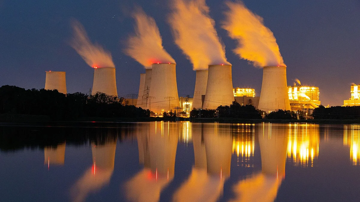 <div class="paragraphs"><p>Cooling towers release vapor at the Jaenschwalde lignite coal-fired power plant, operated by EP Power Europe AS, in Peitz, Germany, on Tuesday, June 21, 2022. </p></div>