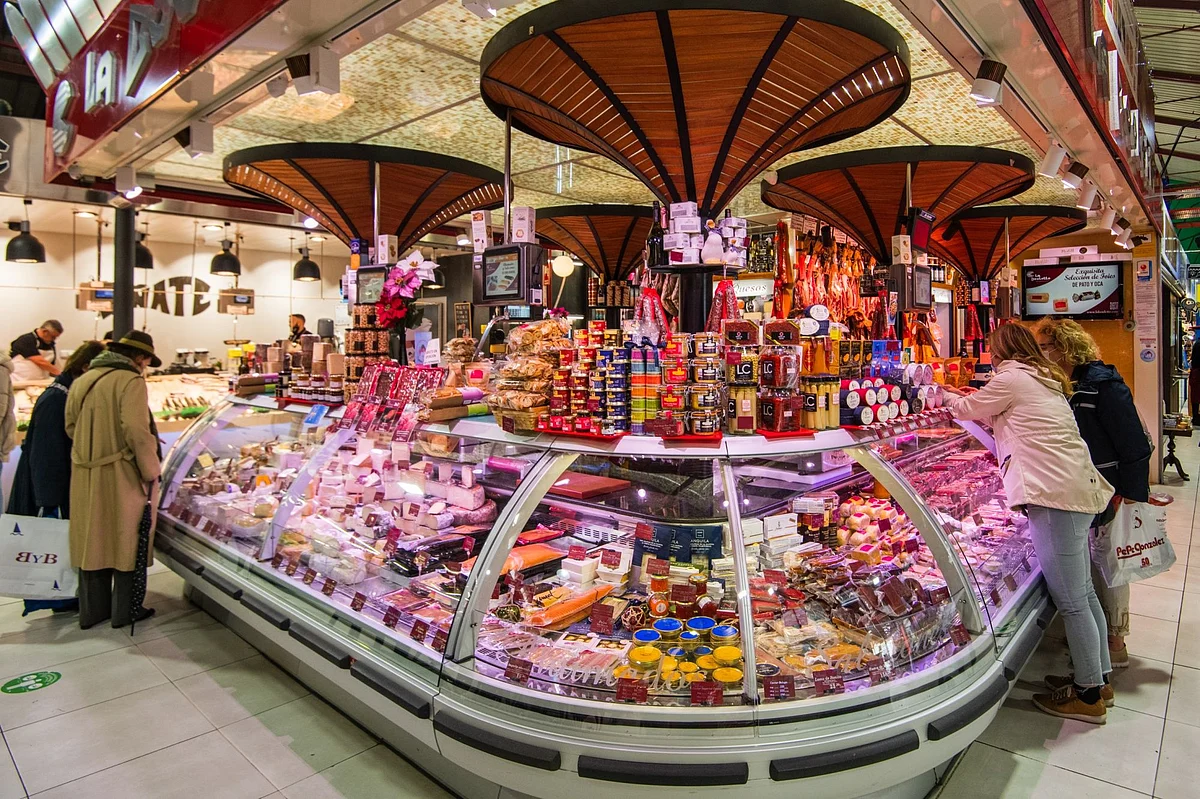 <div class="paragraphs"><p>Cheeses on display in a counter at a delicatessen stall in a market in Madrid, Spain, on Wednesday, April 20, 2022. </p></div>