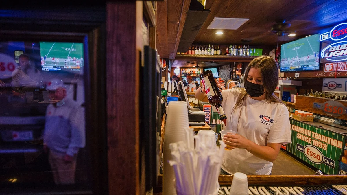 A bartender prepares a drink in Clemson, South Carolina. Photographer: Micah Green/Bloomberg