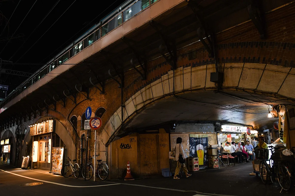 Restaurants built under railway tracks. Photographer: Noriko Hayashi/Bloomberg