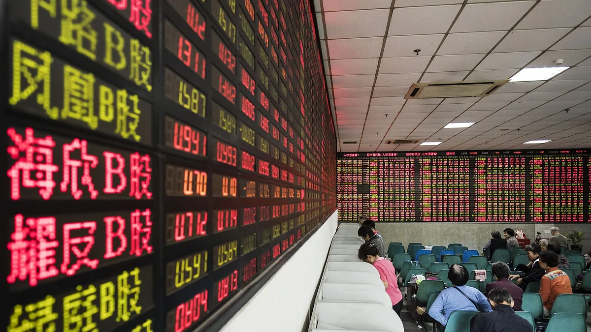 <div class="paragraphs"><p>Investors stand at trading terminals in front of electronic stock boards at a securities brokerage in Shanghai, China. Photographer: Qilai Shen/Bloomberg</p></div>