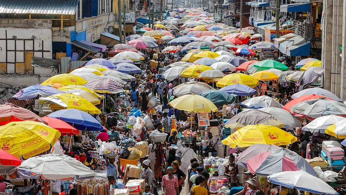 <div class="paragraphs"><p>Crowds of customers make their way through a food market.</p></div>