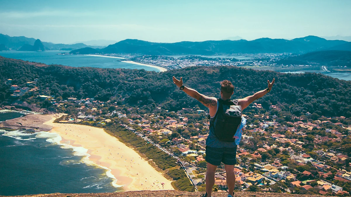 <div class="paragraphs"><p>A tourist standing at the edge of a cliff overlooking the sea and mountains. (Photo by <a href="https://unsplash.com/@echaparro?utm_source=unsplash&utm_medium=referral&utm_content=creditCopyText">Edgar Chaparro</a> on <a href="https://unsplash.com/s/photos/travelling?utm_source=unsplash&utm_medium=referral&utm_content=creditCopyText">Unsplash</a>)</p></div>