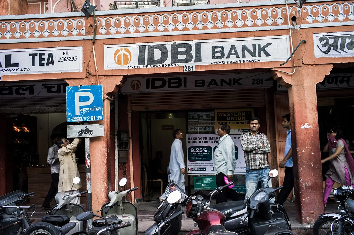 <div class="paragraphs"><p>A pedestrian walks past an IDBI Bank ATM in Jaipur. (Photo: Sanjit Das/Bloomberg)</p></div>