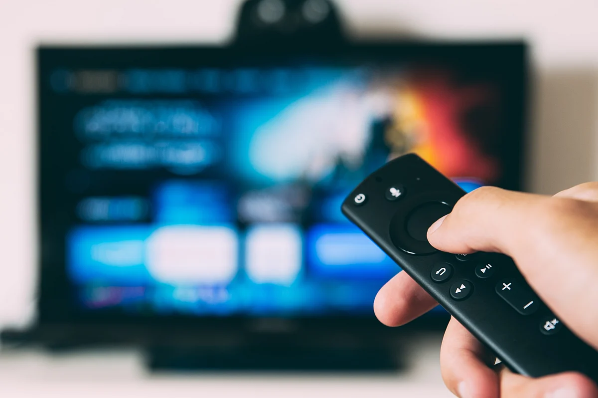 <div class="paragraphs"><p>A person using a TV remote. (Photo: Glenn-Carstens Peters/ Unsplash)</p></div>