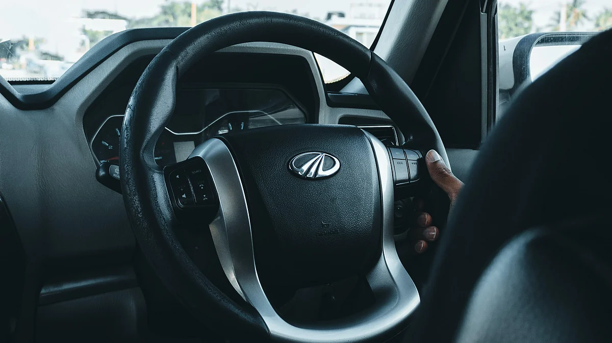 <div class="paragraphs"><p>The Mahindra badge is pictured on a steering wheel. (Photo: Unsplash)</p></div>