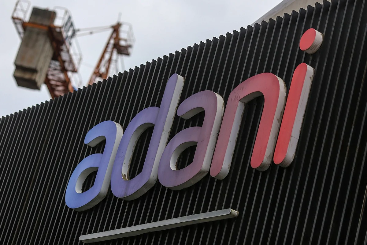 <div class="paragraphs"><p>Signage of Adani Group at company's residential building under construction in Mumbai. (Photo: Dhiraj Singh/Bloomberg)</p></div>
