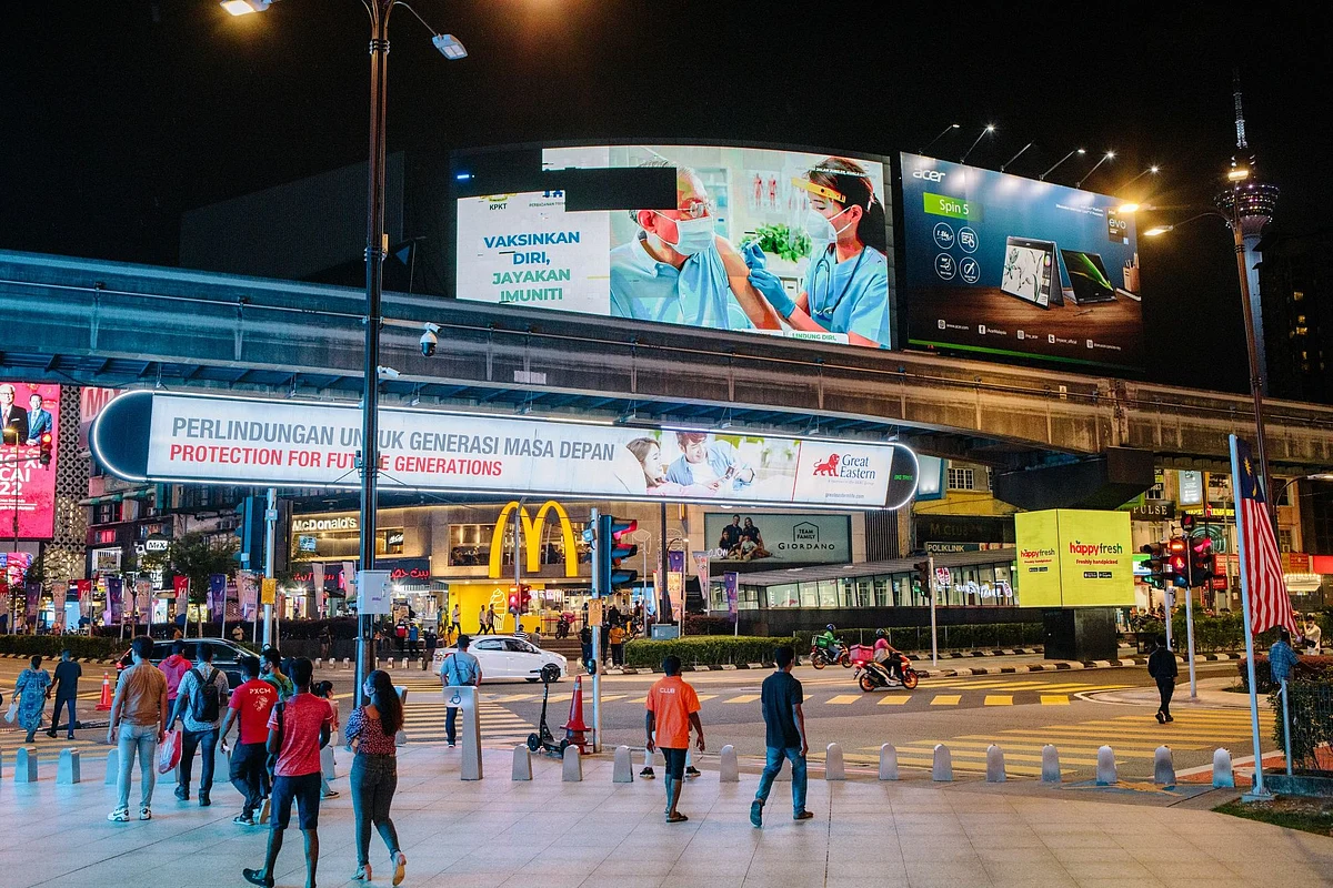 <div class="paragraphs"><p>Pedestrians across from a McDonald's restaurant in the business district in Kuala Lumpur, Malaysia.</p></div>