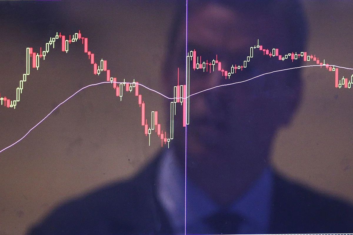 NEW YORK, NY - AUGUST 25: A trader is reflected in a market screen on the floor of the New York Stock Exchange (NYSE) on August 25, 2015 in New York City. Following a day of steep drops in global markets, the Dow Jones industrial average rallied early in the day only to fall over 200 points at the close. (Photo by Spencer Platt/Getty Images)