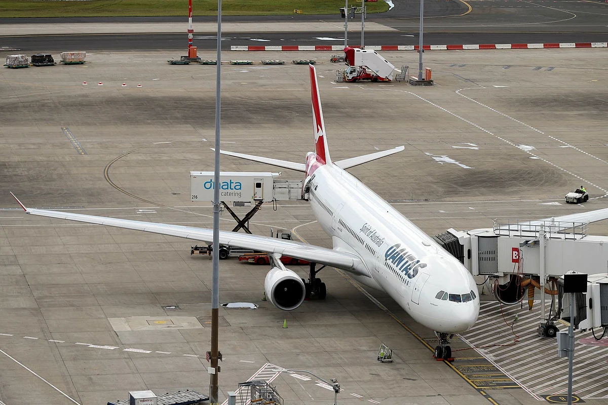 A Qantas Airways Ltd. aircraft on the tarmac at Sydney Airport in Sydney, Australia, on Friday, Dec. 10, 2021. The Australian Competition & Consumer Competition will not oppose Sydney Aviation Alliances proposed acquisition of Sydney Airport. Photographer: Brendon Thorne/Bloomberg