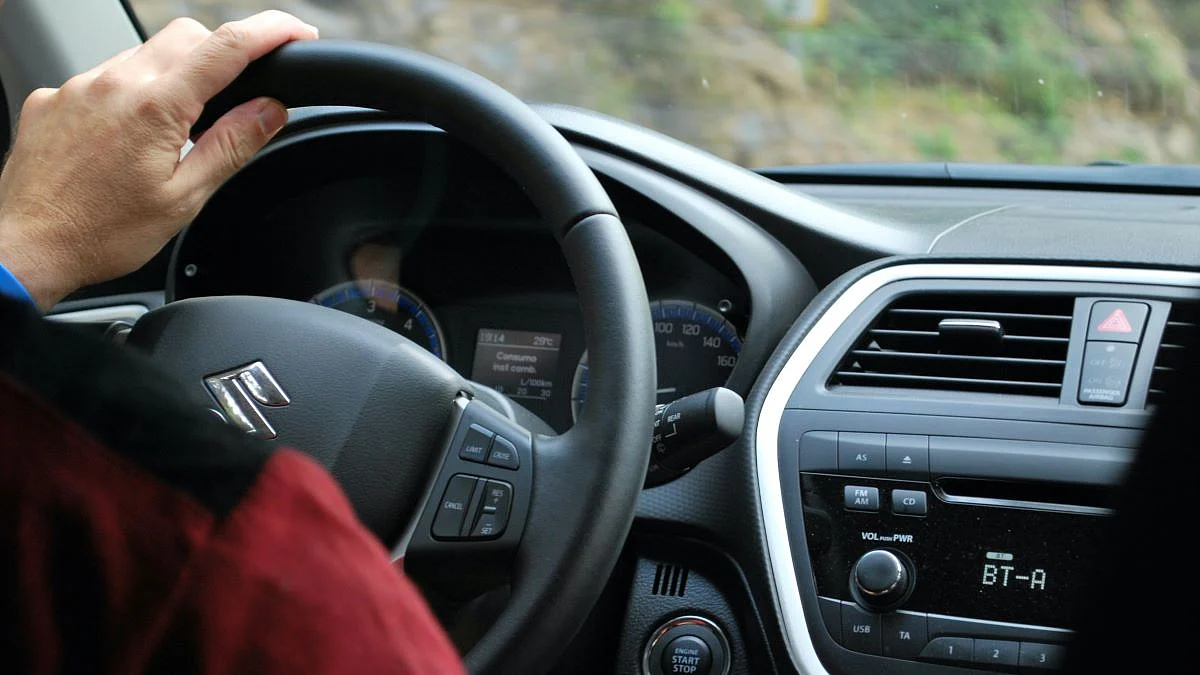 <div class="paragraphs"><p>The Suzuki logo on the steering wheel of a car. (Photo: Unsplash)</p></div>