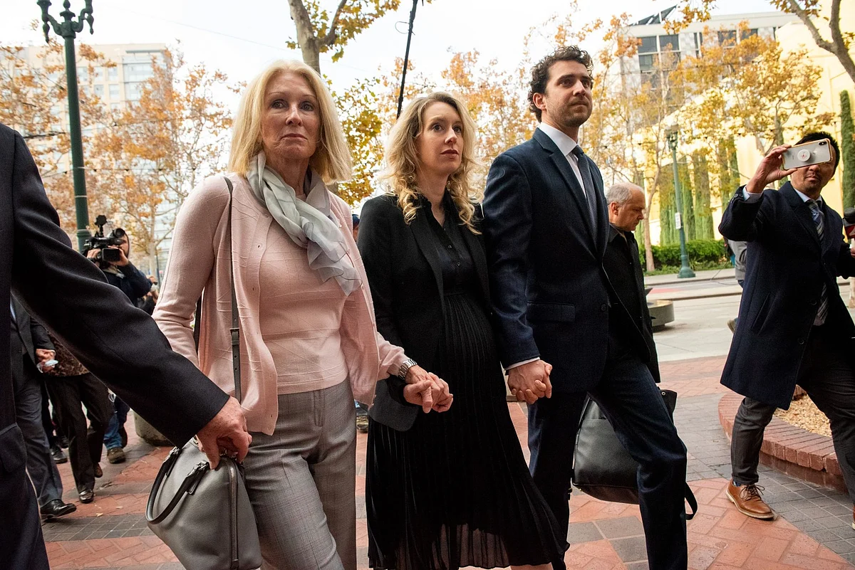 Elizabeth Holmes, center, arrives at federal court in San Jose, Calif., on Friday. Photographer: Marlena Sloss/Bloomberg