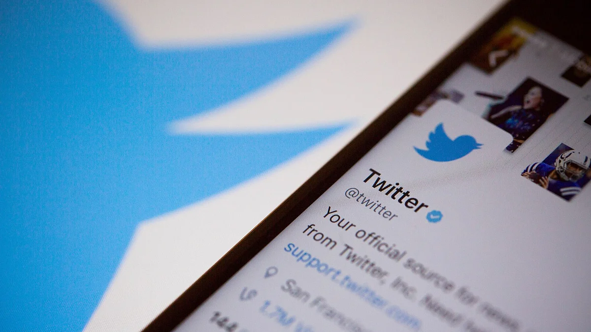 The Twitter Inc. logo is seen behind an Apple Inc. iPhone 6s displaying the company's mobile application in this arranged photograph taken in New York, U.S., on Tuesday, Feb. 9, 2016. Photographer: Michael Nagle/Bloomberg