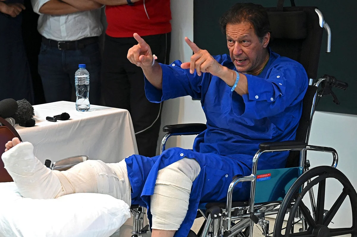 Imran Khan addresses the media representatives at a hospital in Lahore on Nov 4, a day after an assassination attempt on him. Photographer: Arif Ali/AFP/Getty Images