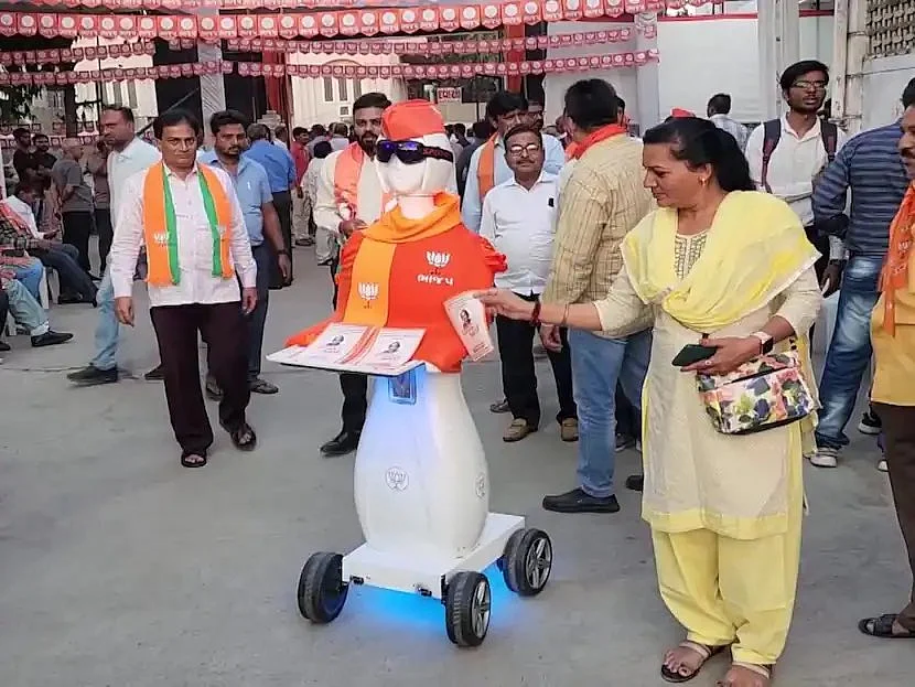 <div class="paragraphs"><p>A robot distributes BJP pamphlets in Gujarat's Nadiad constituency. (Source: BJP Telangana Incharge A Venkata Ramana's Twitter)</p></div>