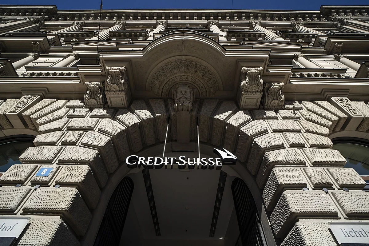 A sign hangs above an entrance to the Credit Suisse Group AG headquarters in Zurich, Switzerland, on Wednesday, Oct. 5, 2022. Credit Suisse has become a poaching ground for rivals in recent times, with the lender struggling to contain the fallout of a series of scandals and flagging performance.
