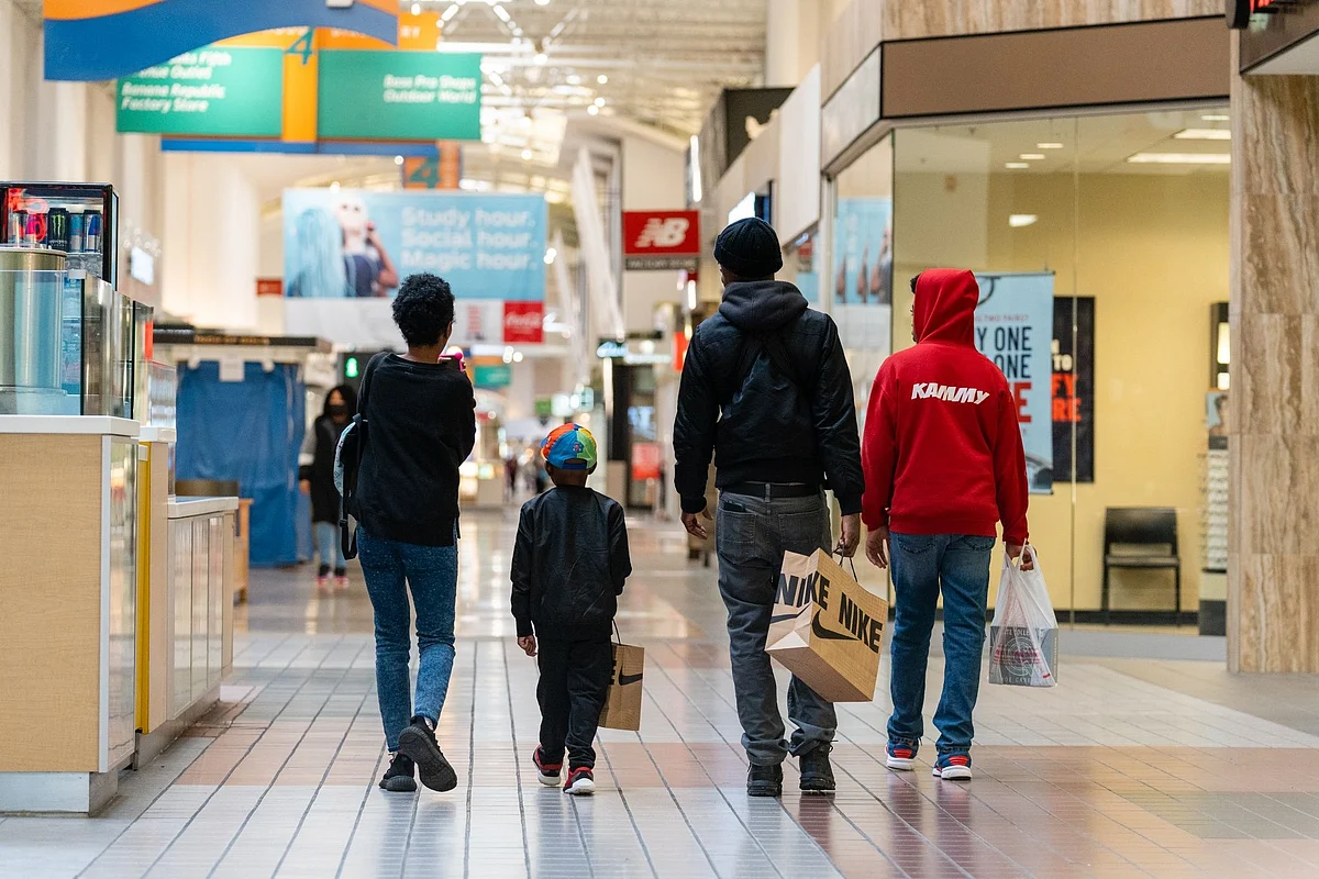 Customers carry Nike shopping bags at a shopping mall in Anne Arundel, Maryland, US, on Wednesday Nov. 9, 2022. The US Census Bureau is scheduled to release retail sales figures on November 16.