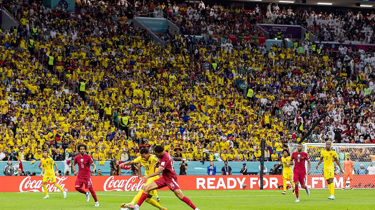 Football players in action during the opening match of the FIFA World Cup between host Qatar and Ecuador, at Al Bayt Stadium in Al Khor, Qatar, on Sunday, Nov. 20, 2022. Qatar 2022 is arguably the most scrutinized World Cup in history, and executives are faced with a dilemma as pundits and politicians raise concerns over the host country.