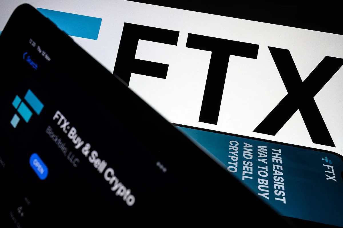 LONDON, ENGLAND - NOVEMBER 10: In this photo illustration the FTX logo and mobile app adverts are displayed on screens on November 10, 2022 in London, England. The Bahamas-based crypto exchange's larger rival, Binance, walked away from a potential bailout deal, as FTX struggles with a wave of customer withdrawals that have created a liquidity crunch. (Photo Illustration by Leon Neal/Getty Images) Photographer: Leon Neal/Getty Images Europe