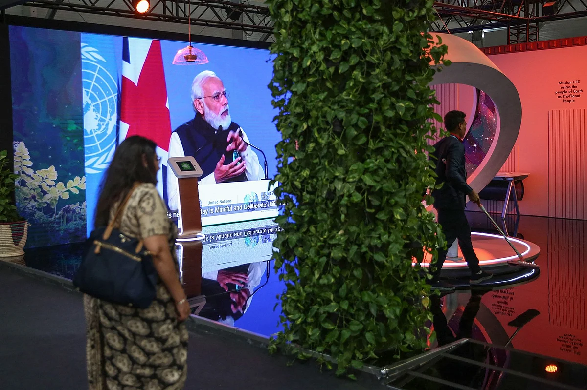 A screen broadcasts India's Prime Minister Narendra Modi at the India pavilion at the COP27 climate conference at the Sharm El Sheikh International Convention Centre in Sharm El-Sheikh, Egypt, on Tuesday, Nov. 8, 2022. More than 100 world leaders are set to be in Sharm el-Sheikh, Egypt over the next two weeks for the UNs annual climate talks.