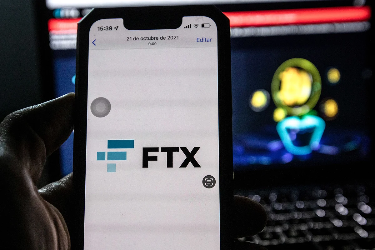 The FTX logo on a smartphone arranged in Barcelona, Spain, on Tuesday, Nov. 15, 2022. FTX Group named a slate of new independent directors to oversee the collapsed crypto empire and said its bankruptcy may involve more than a million creditors. Photographer: Angel Garcia/Bloomberg