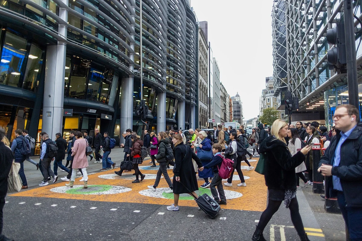 Commuters cross a junction, during a one day strike by London Underground workers, in London, UK, on Thursday, Nov. 10, 2022. Parisians and Londoners face similar chaos trying to get to and from offices on Thursday as public transportation workers strike to protest the rising cost of living.
