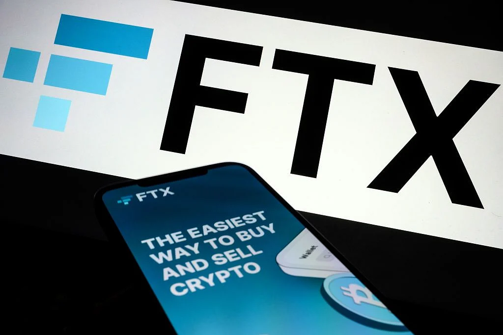 LONDON, ENGLAND - NOVEMBER 10: In this photo illustration the FTX logo and mobile app adverts are displayed on screens on November 10, 2022 in London, England. The Bahamas-based crypto exchange's larger rival, Binance, walked away from a potential bailout deal, as FTX struggles with a wave of customer withdrawals that have created a liquidity crunch. (Photo Illustration by Leon Neal/Getty Images) Photographer: Leon Neal/Getty Images Europe