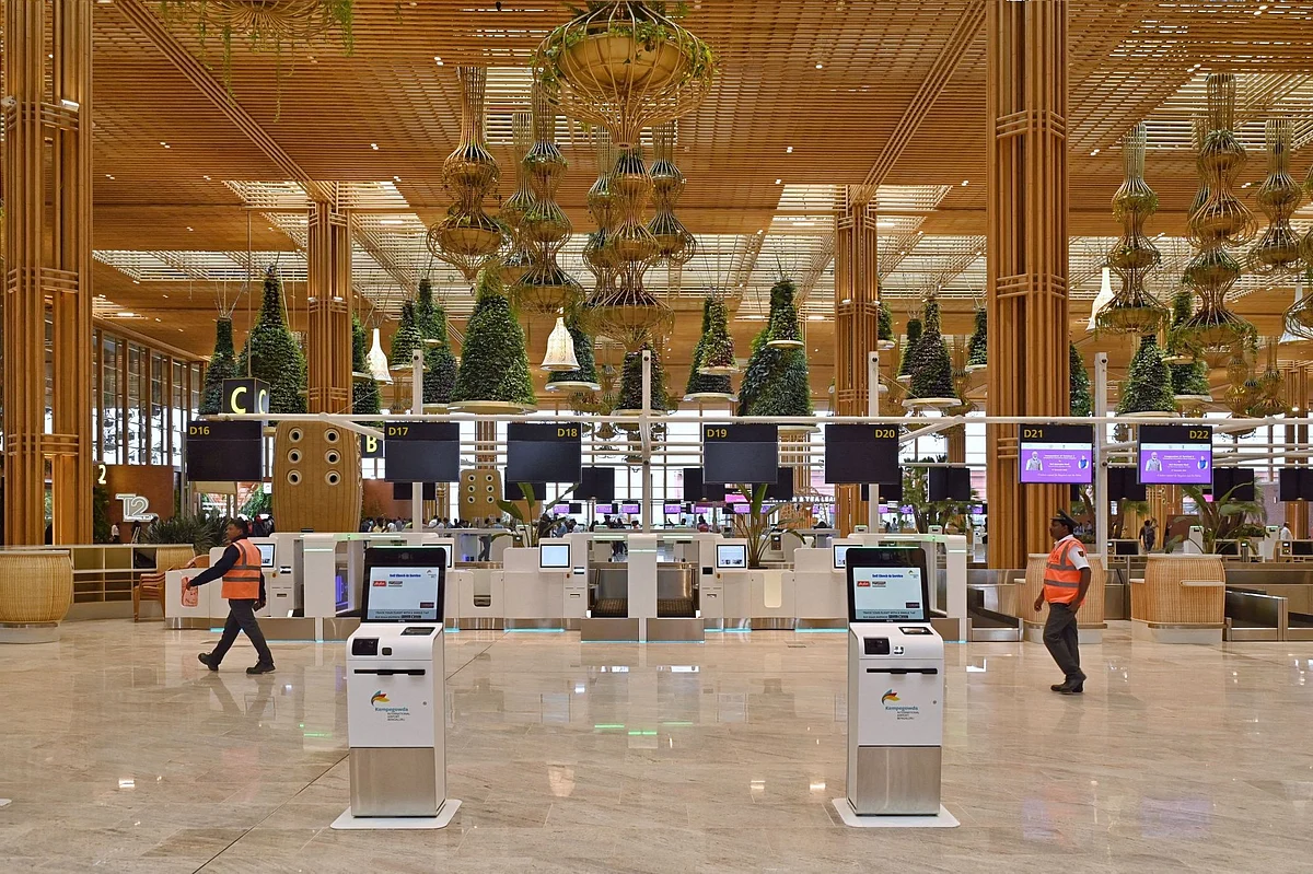Visitors walk in front of the passenger baggage check-in counter of the newly inaugurated Terminal 2 (T2) at the Kempegowda International Airport (KIA) in Bengaluru on November 12, 2022. Photographer: Manjunath Kiran/AFP/Getty Images