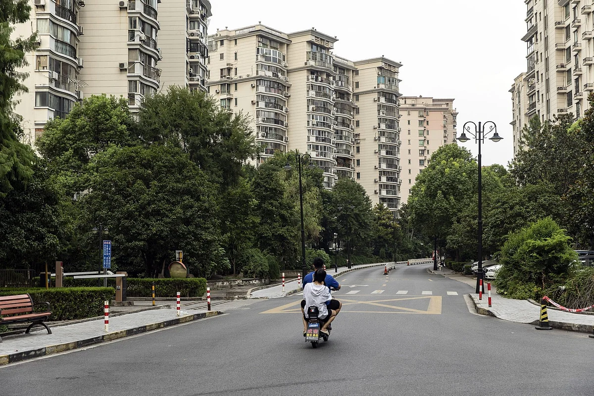 Residential buildings in the Kangcheng neighborhood of Shanghai, China, on Monday, Aug. 1, 2022. In a country that only tolerates dissent in small doses—and relies on property as its economic growth engine—a mortgage boycott by hundreds of thousands of middle-class Chinese has become a five-alarm fire for authorities. Photographer: Qilai Shen/Bloomberg