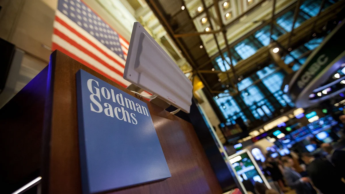 Goldman Sachs Group Inc. signage is displayed at the company's booth on the floor of the New York Stock Exchange (NYSE) in New York, U.S., on Tuesday, May 30, 2017. U.S. stocks halted a seven-day advance, while the dollar fluctuated as data showing a rebound in consumer spending offset a wider selloff in commodities. The euro slipped with equities in the region.