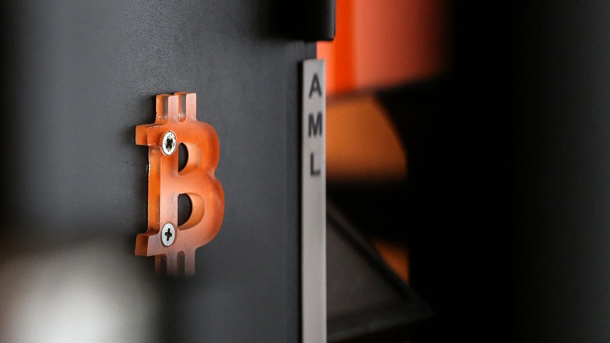 The Bitcoin logo outside a cryptocurrency automated teller machine (ATM) kiosk in Antwerp, Belgium, on Monday, June 6, 2022. Bitcoin has been trading around the $30,000 level for weeks now, defying predictions of a potential further decline but also struggling to gain upward momentum as the broader US market has also taken a beating. Photographer: Valeria Mongelli/Bloomberg