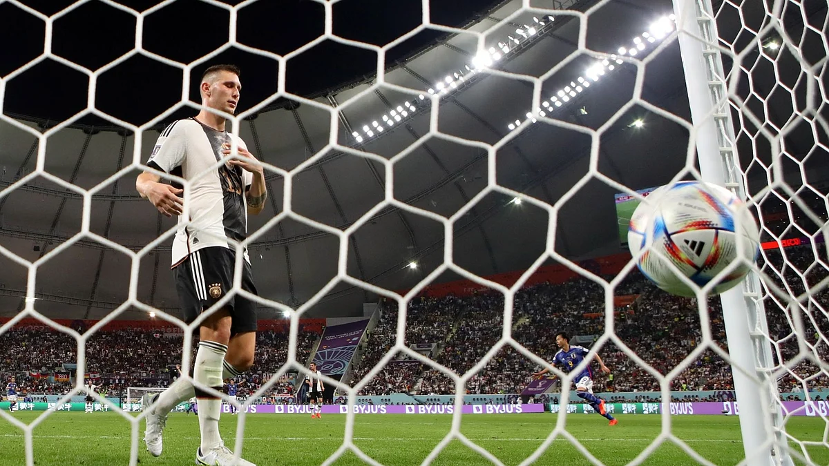 DOHA, QATAR - NOVEMBER 23: Niklas Suele of Germany reacts after Takuma Asano of Jpaan scored their team's second goal during the FIFA World Cup Qatar 2022 Group E match between Germany and Japan at Khalifa International Stadium on November 23, 2022 in Doha, Qatar. (Photo by Alex Grimm/Getty Images)