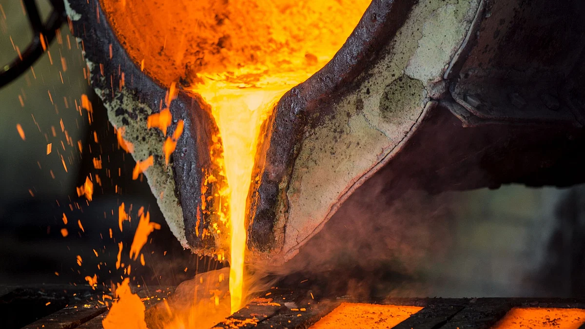 A molten mixture of lead and bronze pours from a cauldron into moulds in the foundry at the copper mining and smelting complex, operated by RTB Bor Group, in Bor, Serbia, on Tuesday, Feb. 28, 2017. Mining and Smelting Combine Bor is the only producer of copper and precious metals (gold and silver) in Serbia. Photographer: Oliver Bunic/Bloomberg