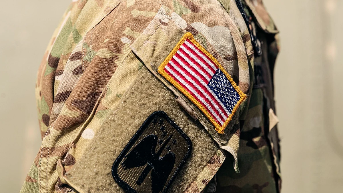<div class="paragraphs"><p>The US national flag on the arm of a soldier from the US army aviation, 12th Combat Aviation Brigade. Photographer: Roni Rekomaa/Bloomberg</p></div>