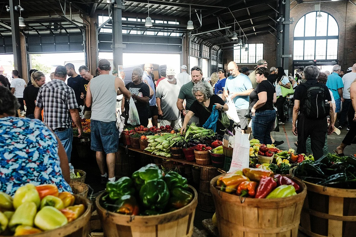 Customers shop for produce at the Eastern Market in Detroit.