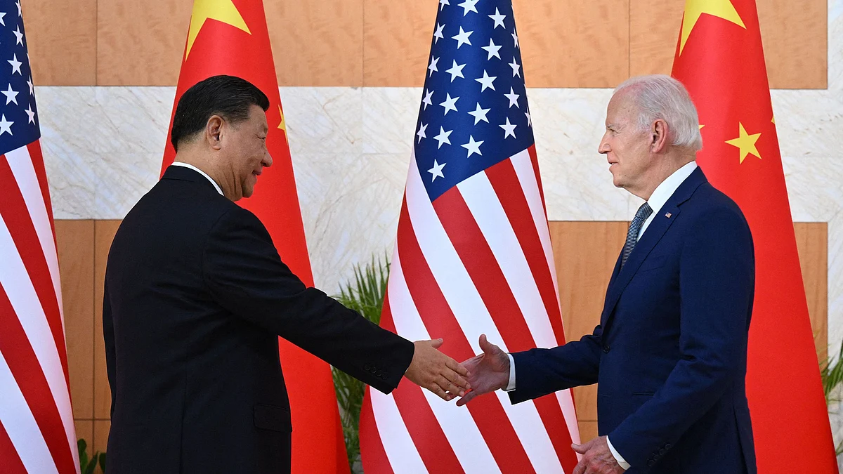 <div class="paragraphs"><p>Xi Jinping and Joe Biden shake hands as they meet on the sidelines of the G20 Summit in Nusa Dua, Bali, on Nov. 14. (Photographer: Saul Loeb/AFP/Getty Images)</p></div>